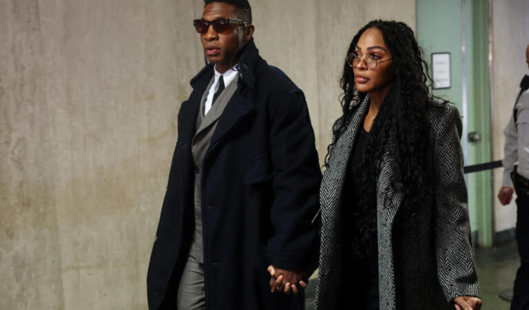 Jonathan Majors arrives for domestic violence trial with Meagan Good at his side and a Bible in hand. ‘That is not by mistake,’ says legal expert.